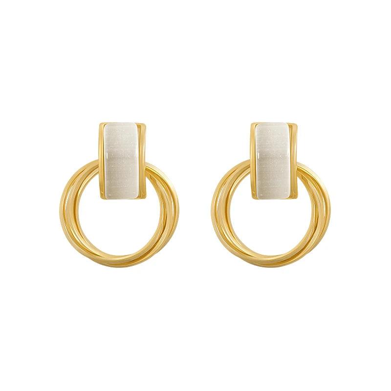WOLZI Opaline Halo Drop Earrings in gold with white rectangular stones
