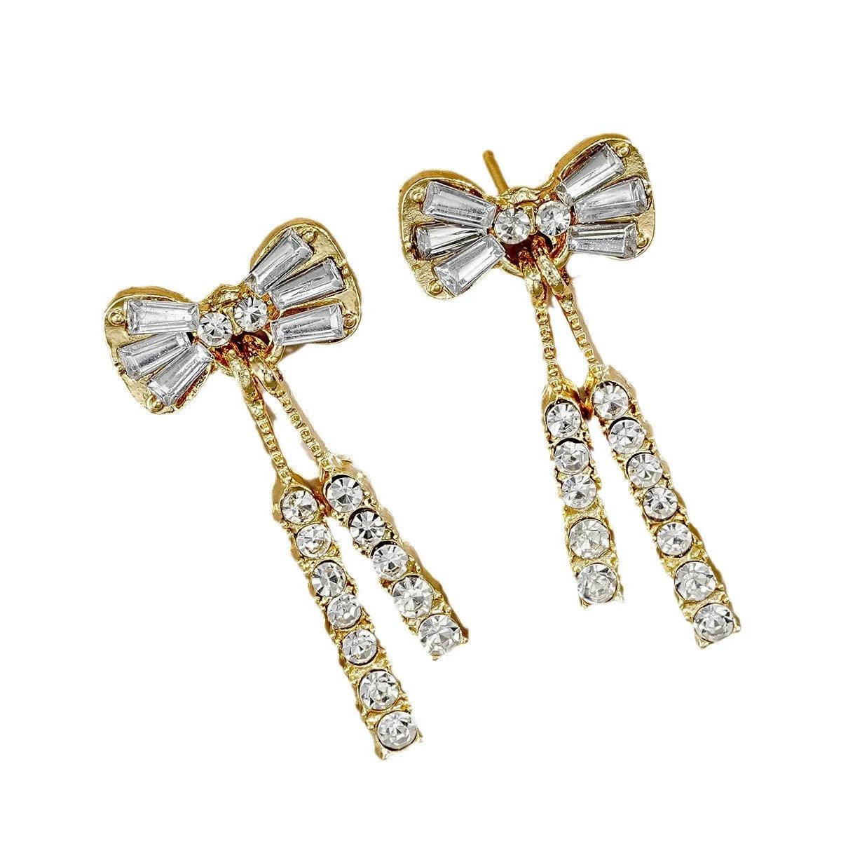 WOLZI Elodie Crystal Bow Stud Earrings in gold tone