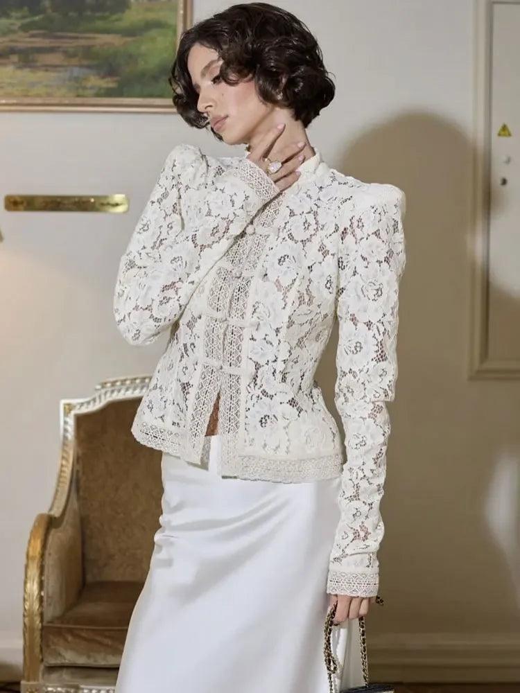 WOLZI Fontaine Lace Blouse in white with long sleeves and intricate floral patterns.