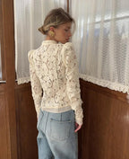 WOLZI Fontaine Lace Blouse in beige featuring long sleeves and intricate floral patterns.