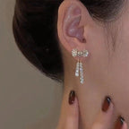 WOLZI Elodie Crystal Bow Stud Earrings in silver tone