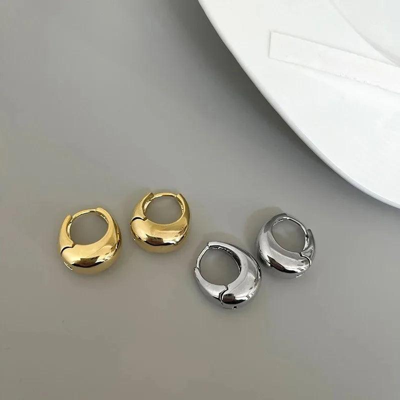 Aurelle Sculpted Oval Earrings in gold and silver tones by WOLZI
