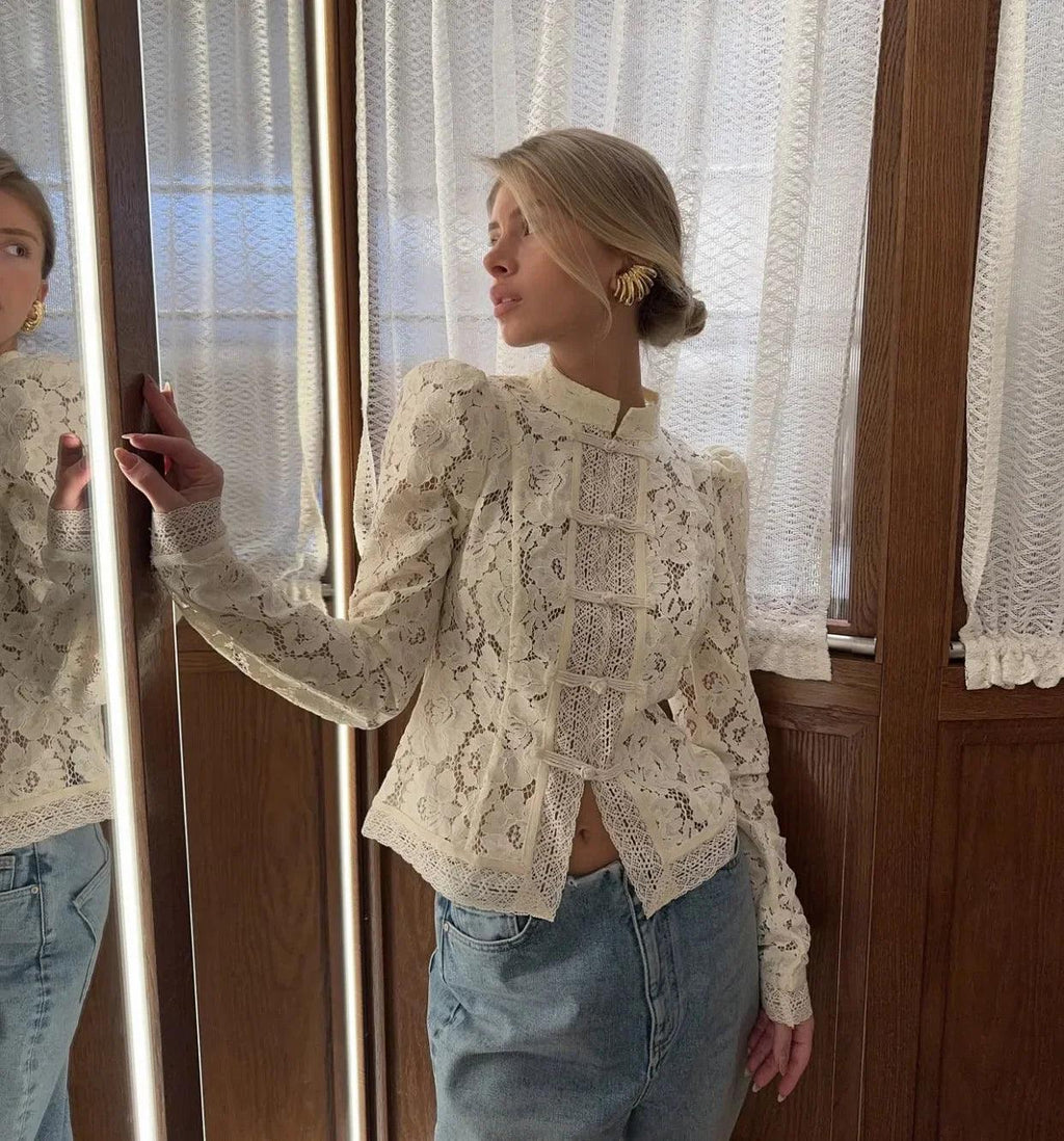 Woman wearing WOLZI Fontaine Lace Blouse in beige with long sleeves and intricate lace detail.