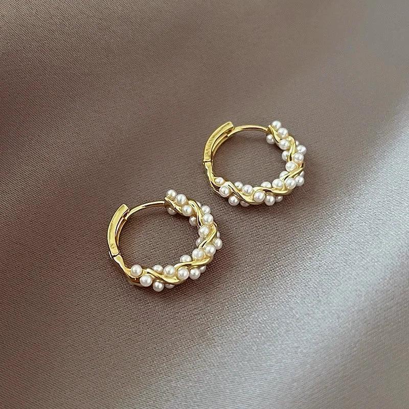 Lumi Pearl Circle Stud Earrings by WOLZI featuring gold-toned hoops with white pearls
