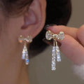 Elodie Crystal Bow Stud Earrings by WOLZI