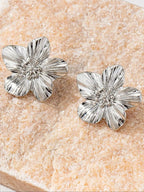 Fleur textured silver flower stud earrings by WOLZI